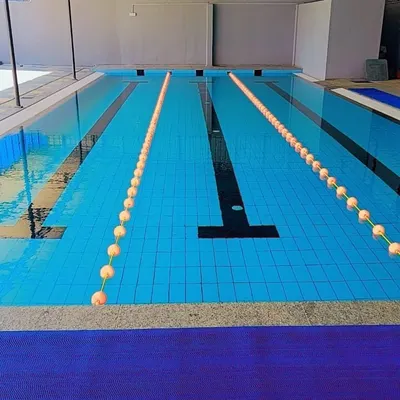 Our 15-meter pool is meticulously maintained to ensure the highest standards of cleanliness for every class. The lane dividers help structure our sessions, allowing for organized and effective group workouts.