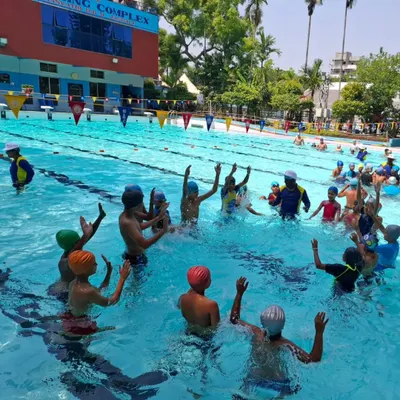 Our coaches making learning fun for kids in one of our international standard pools.