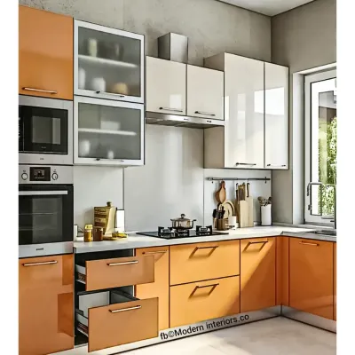 This L-shaped modular kitchen features a warm orange and white color scheme with handle-less cabinets for a sleek look. We incorporated a mix of drawers and cabinets, along with a built-in oven, to ensure maximum functionality and an organized workflow.