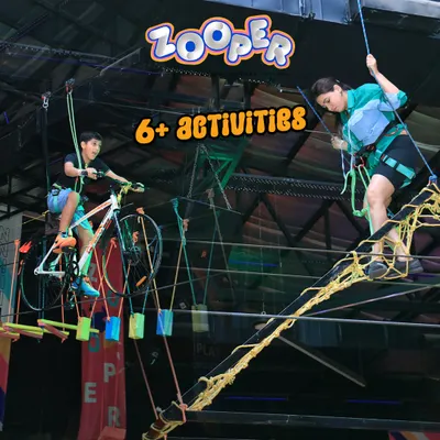 We have over 6 different high-flying activities. Here you can see our sky cycling course and rope obstacle course, suspended high above the trampolines.