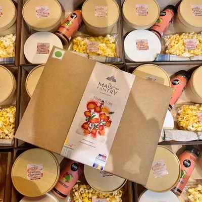 A top-down view of my kids' party boxes ready to go. The custom-branded packaging and neatly arranged items show the care and attention to detail that goes into making each child's meal a special treat.