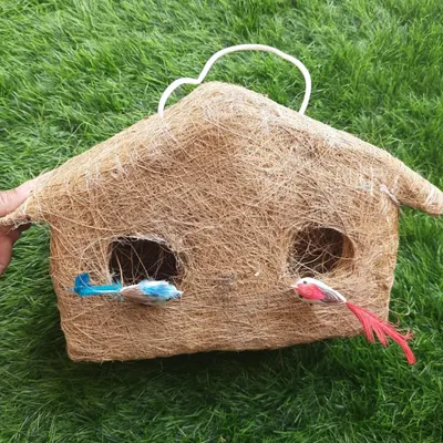 This is a new design for my handmade bird nests. This one is shaped like a little hut and is made from natural coir, providing a safe and cosy home for small birds.