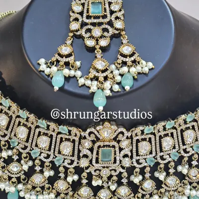 Unique caption for media id 1 describing the specific jewellery and look.