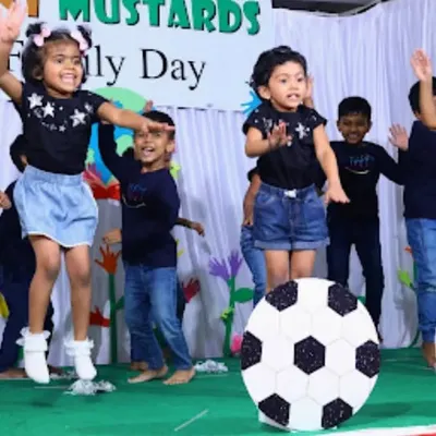 The pure energy and excitement of our Family Day performance. The children worked together to put on a show for their parents, and their joyful jumping says it all.