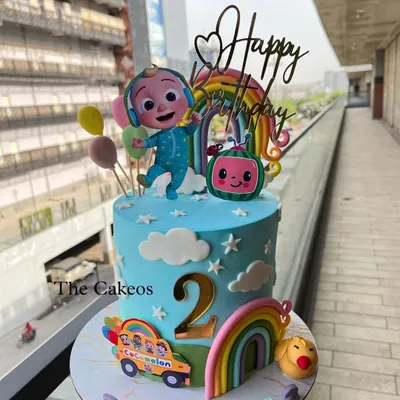 A vibrant Cocomelon themed cake perfect for a second birthday. This eggless cake features JJ, the iconic watermelon, a school bus, and colorful rainbows, bringing all the fun of the show to the party.