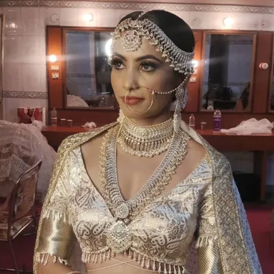 Here is a glimpse of our dedicated makeup station with large mirrors and bright vanity lights, ensuring you have the perfect setup to work on your models before the shoot begins.