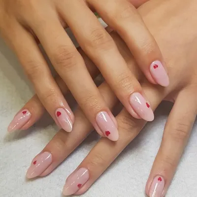 The finished product. Here are the delicate heart nails, perfectly executed on a sheer pink base with an elegant almond shape. I love making your nail dreams come true.