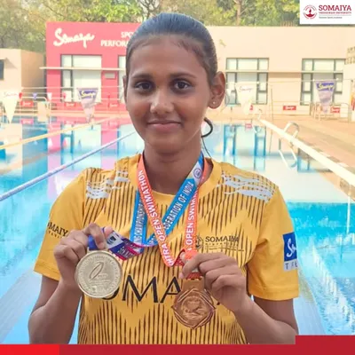 Surbhi Shrikrishna Shinde proudly displays her silver and bronze medals won at the 5th National Finswimming Championship, a great achievement for our junior college athlete.
