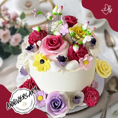 A vibrant garden of love for Tushar and Jiya's anniversary in Sushant Lok. This stunning cake is overflowing with a variety of colorful, handcrafted sugar flowers, making it a true feast for the eyes.