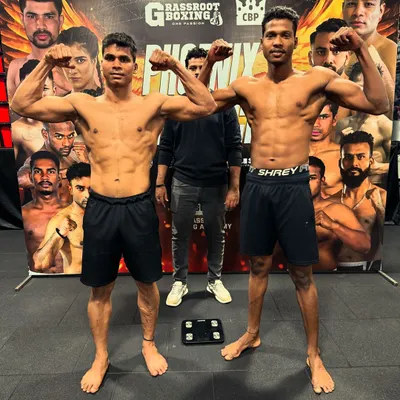 This is the result of dedication. Two of my fighters at a weigh-in, physically peaked and ready for battle. They earned this physique through relentless training.