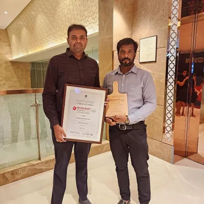 Posing with my head chef and our "Dessert Parlour of the Year" award. This achievement belongs to the entire team that works tirelessly every day.