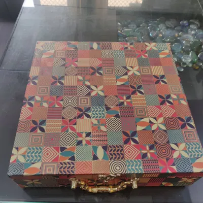 This is the exterior of a large, custom wedding box I created for my brother's wedding. The vibrant, patterned suitcase-style box with a handle is a gift in itself.