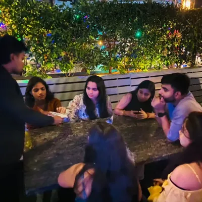 This is my walkaround magic in action. I approach a table, introduce myself, and perform a few quick tricks. It's a great way to entertain guests at restaurants and social gatherings.