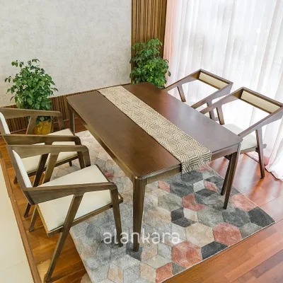 Our Zircon dining set features a solid Teak wood table with a sleek, modern profile, paired with our distinctive Z-frame chairs. The chairs are upholstered in a neutral Asian Paints Allura fabric for comfort and style.