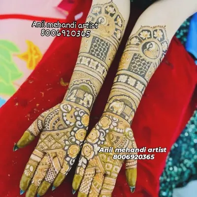 A full-coverage bridal design featuring elephant and peacock motifs. The mix of delicate floral patterns and bold geometric shapes creates a stunning contrast.