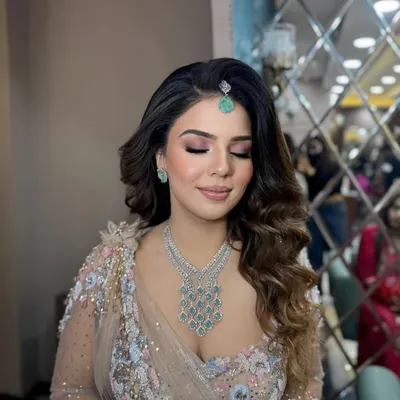 This is my signature soft glam makeup. A flawless base, soft pink smokey eyes, and a neutral lip create a look that's both romantic and sophisticated.