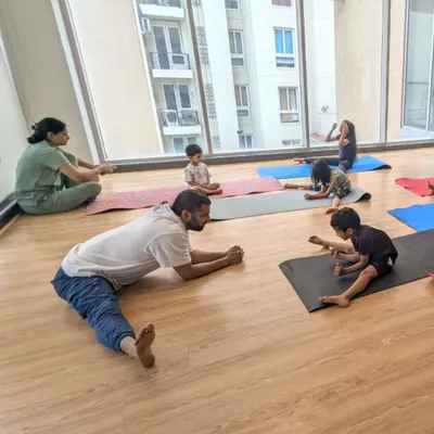 Leading by example during a flexibility session with our young students. Proper stretching is a crucial part of our dance and fitness training.