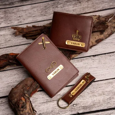 This men's daily essentials kit includes a personalized wallet, passport cover, and keychain. You can mix and match charms, like the airplane and crown shown here.