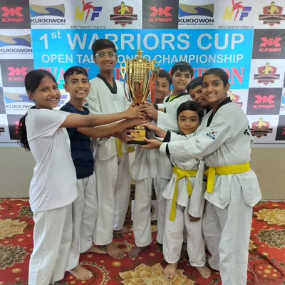Hoisting the overall championship trophy at the 1st Warriors Cup Open Taekwondo Championship. A massive victory for Team Prahar.