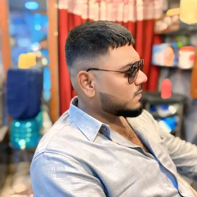A classic men's crop with a high skin fade. This haircut is clean, sharp, and very low maintenance, perfect for a modern and stylish look.