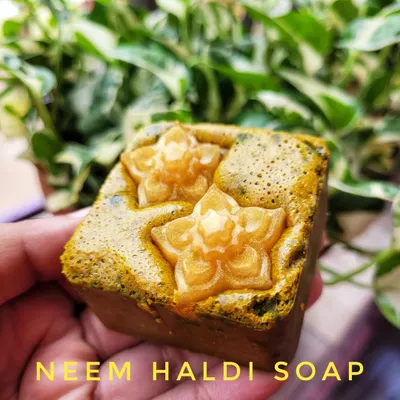 My Neem Haldi soap, intricately designed and packed with benefits. This soap is a powerhouse for clearing acne scars, preventing breakouts, and improving skin tone thanks to the natural properties of neem and wild turmeric.