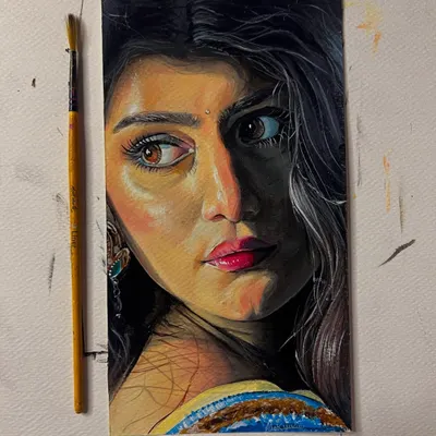 A completed acrylic portrait on short paper. I focused on capturing the story in her eyes and the dramatic lighting on her face.
