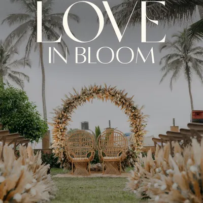 The stunning wedding ceremony setup on a Goan lawn, with a pampas grass arch and the ocean in the background, ready for love to bloom.