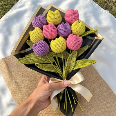 Our 'Twirling Tulips' bouquet is a burst of color and joy. Featuring bright yellow, pink, and purple tulips, it's one of our most popular designs for a reason.
