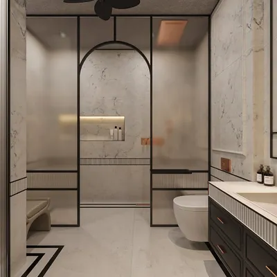 To create a cohesive design, we extended the bedroom's classical elegance into this bathroom. Marble-clad walls are framed with subtle molding, while a frosted glass archway for the shower adds a modern, graphic touch.