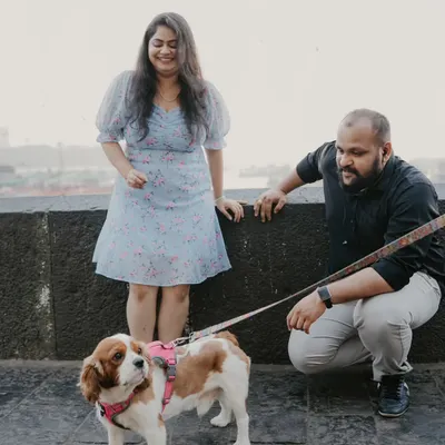 A lovely moment during an urban shoot where the couple crouches down to pose with their adorable Cavalier King Charles Spaniel. This shows how we can easily incorporate your pet into any location.