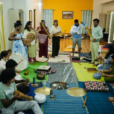 A moment from my Ojas Sound Healing Teacher Training Course. A diverse group of students, from doctors to musicians, are learning to use various instruments like the frame drum and bamboo flute.