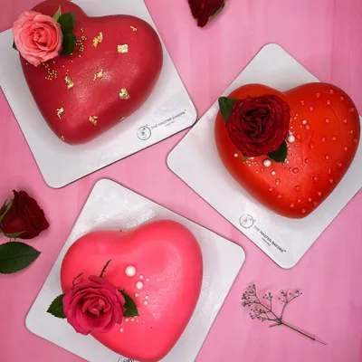 Love comes in many flavors. Here is a trio of our heart-shaped cakes, perfect for Valentine's Day, anniversaries, or just to say "I love you." Each one is uniquely decorated, from gold-flaked red fondant to fresh roses.