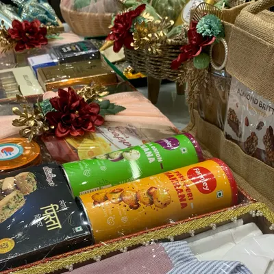 A glimpse of a complete trousseau packing project. We use decorative trays, baskets, and elegant wrapping to present everything from snacks and clothes to other gifts for the family.