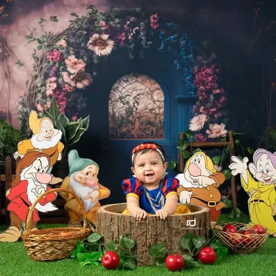 Our little Snow White, surrounded by all seven dwarfs in an enchanted forest. This is one of my favorite fairytale themes to create.