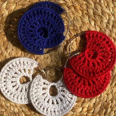 These are my 'Chand Baliyan' inspired crochet earrings. They are lightweight and can be made in a variety of colors like this vibrant red, white, and blue set.