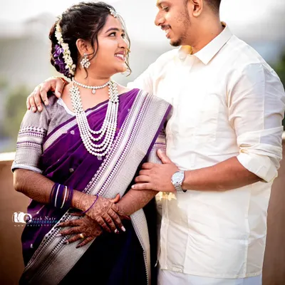 A beautiful wedding day portrait of a South Indian couple. The way they look at each other captures a moment of quiet connection and happiness amidst the day's celebrations.
