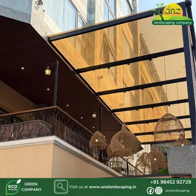 For this project, we used tinted glass for the pergola roof to reduce glare while still allowing light through. The addition of stylish wicker pendant lights adds a decorative touch to the outdoor space.
