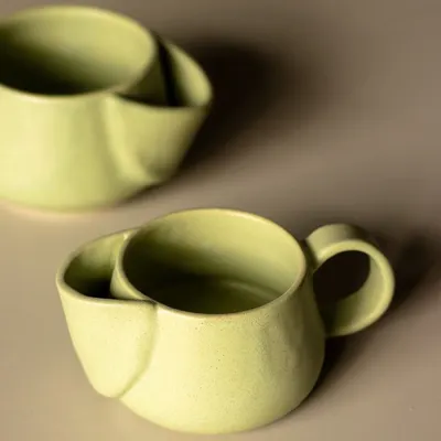 The famous kangaroo mug. We designed this with a clever little pocket on the side to hold your tea bag string or a small cookie. It’s functional, quirky, and a total conversation starter.