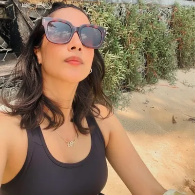 Finding moments of calm and sun on a solo beach day. A healthy lifestyle gives you the energy and confidence to enjoy your own company and explore.