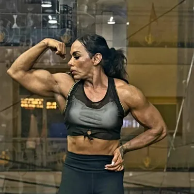 I train champions, both men and women. This is my athlete Reetu Verma, perfectly conditioned and ready to dominate the women's physique stage. Her power and definition are proof of our focused preparation.