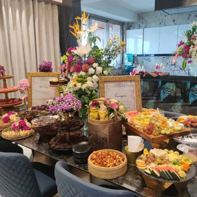 A stunning and abundant grazing table curated for the Mehta family's housewarming soirée. The spread was designed to match the celebratory mood, featuring everything from artisanal chocolates to Indian mithais and savouries.