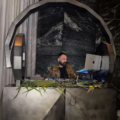 Behind the console is my universe. This custom-designed DJ booth, set against a dramatic backdrop, reflects the premium and bespoke experience I provide for luxury events, where every detail is curated for maximum impact.