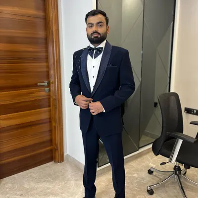 Another angle of this sharp tuxedo look. We pay close attention to every detail, ensuring our grooms look confident and well-put-together from every viewpoint.