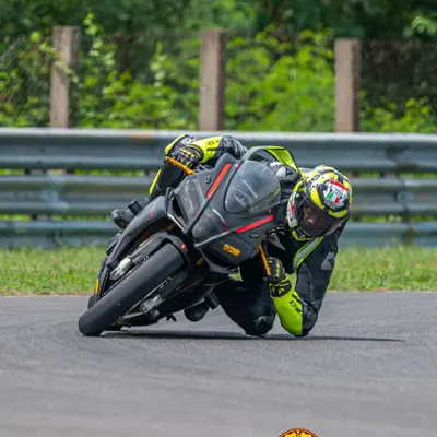 One of our instructors showing how it's done with an elbow-down moment. We teach advanced body positioning to help you maximize lean angle and cornering speed.