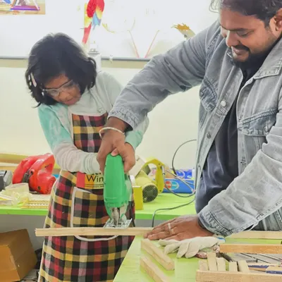 With our complete guidance, this young maker learns to use a jigsaw. We ensure every child understands the tool and feels confident while making precise cuts for their woodworking project.