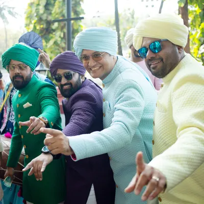 A vibrant baraat with the men of the family in synchronized outfits. We created these colorful, coordinated looks to bring a super cool vibe and create lifelong memories through photos.