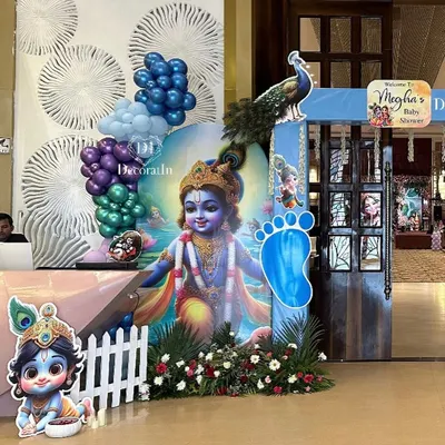 A divine welcome for a little one with our Krishna-themed baby shower decor. This grand entrance features a large cutout of baby Krishna, peacock details, and a vibrant balloon garland, creating a blessed and beautiful atmosphere.