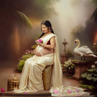 Inspired by the classic tale of Shaakunthalam, this portrait captures the mother-to-be in a serene, painterly setting with a swan and lotus flowers.