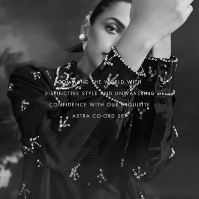 A black and white close-up of our Astra Co-ord Set, highlighting the intricate, shimmering embellishments on the cuffs and collar.