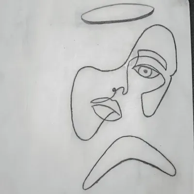 The first step is mastering line work on synthetic practice skin. This one-liner face design helps students develop a steady hand and understand needle depth without any risk.